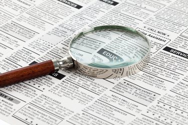 Classified Ad and magnifying glass