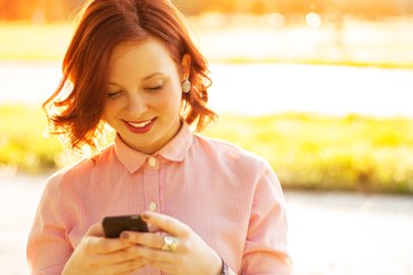 Young woman using a smartphone outdoors