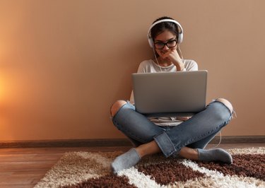 Young female blogger working at home