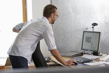 man stands at desk