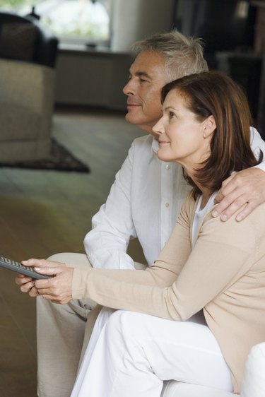 Couple watching television together