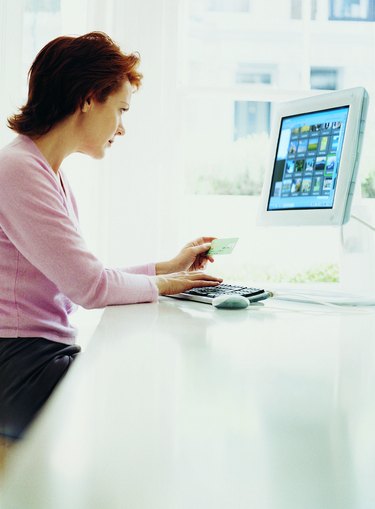 Woman Using her Credit Card on the Internet