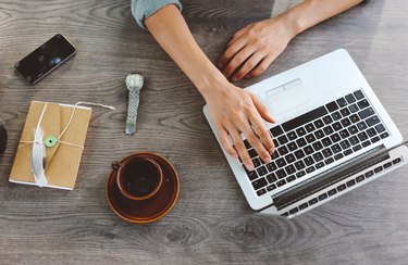 Female blogger writing on the laptop